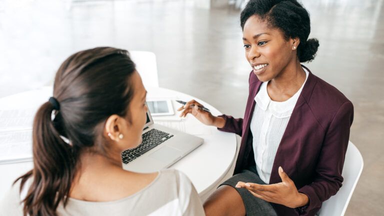 An employee talking to her employer about caregiving duties.