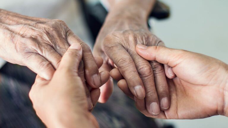 Woman holding hands