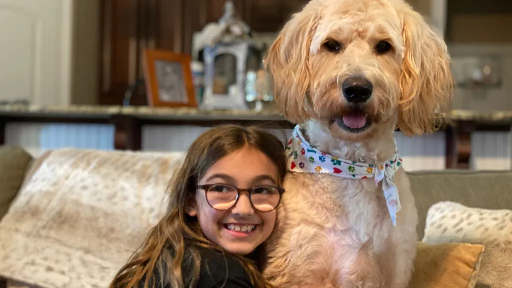 Ella Conrad at home with her dog