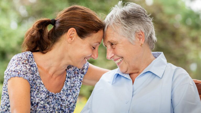 A woman cares for her aging mother.