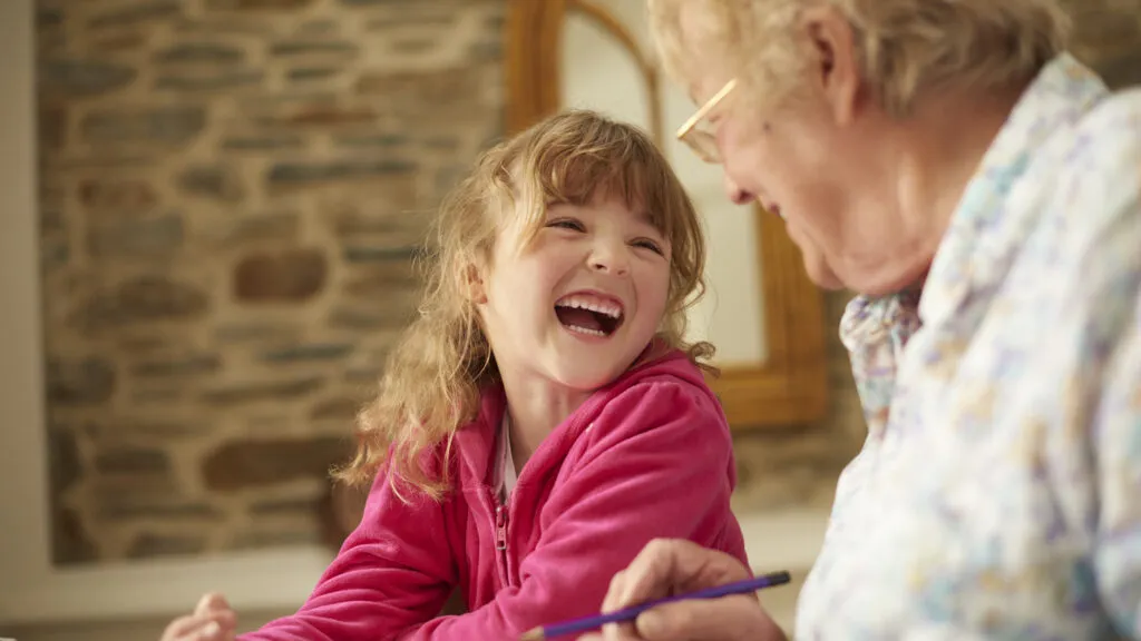 A retired woman helps with child care.