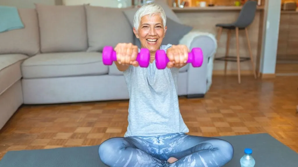 Woman exercises with weights