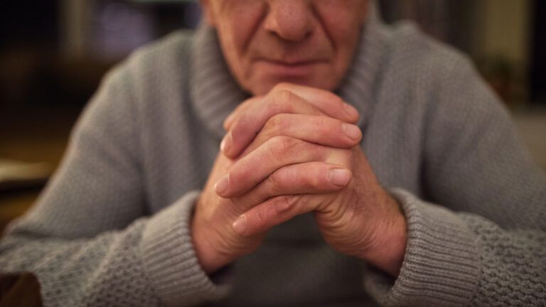 Senior man in prayer