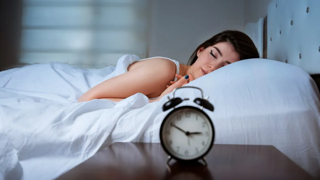 A close-up of a young girl sleeping.