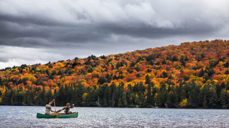 Two people on a canoe in a lake