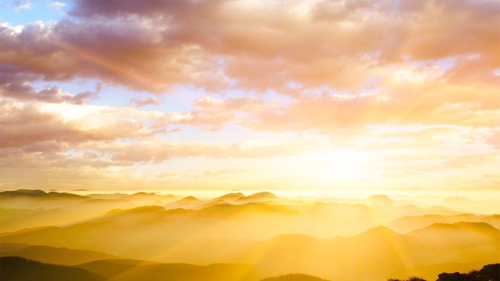 Sunbeams streaming through clouds