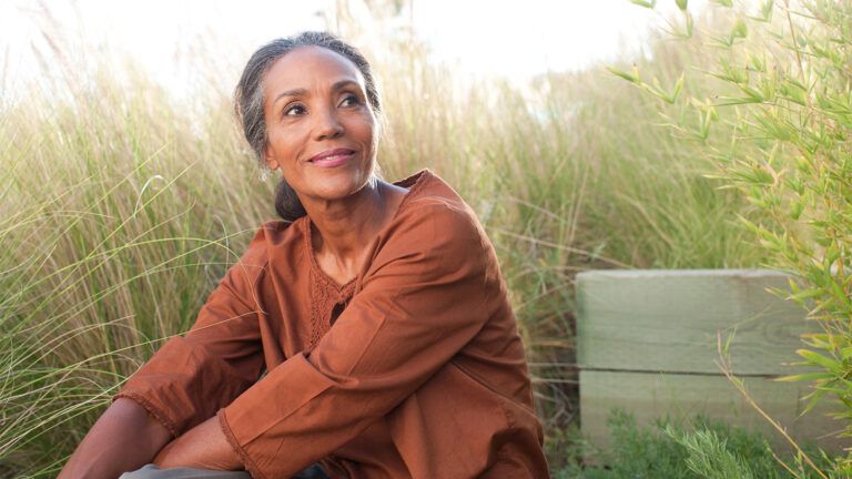 Woman outdoors smiling