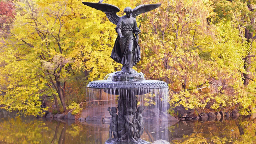 A bronze sculpture of a female winged angel.