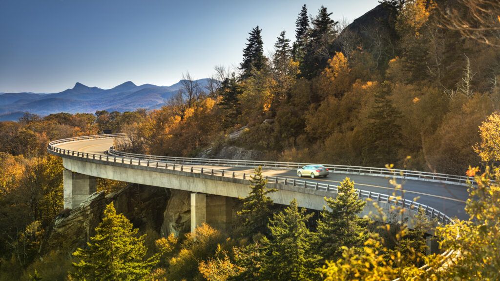 A car driving over a bridge.