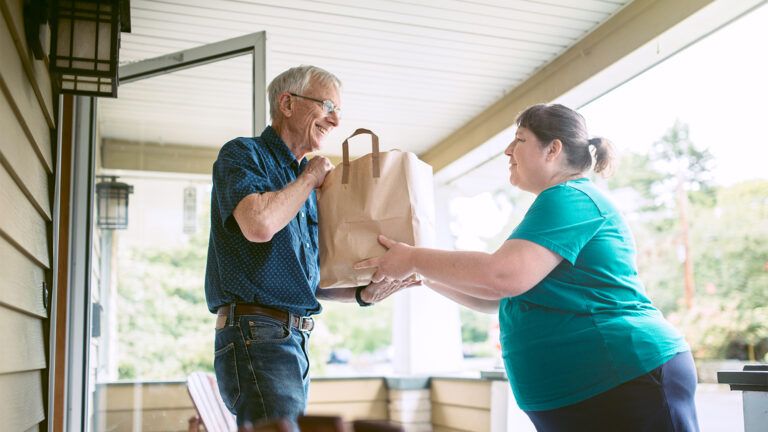 Woman dropping off groceries