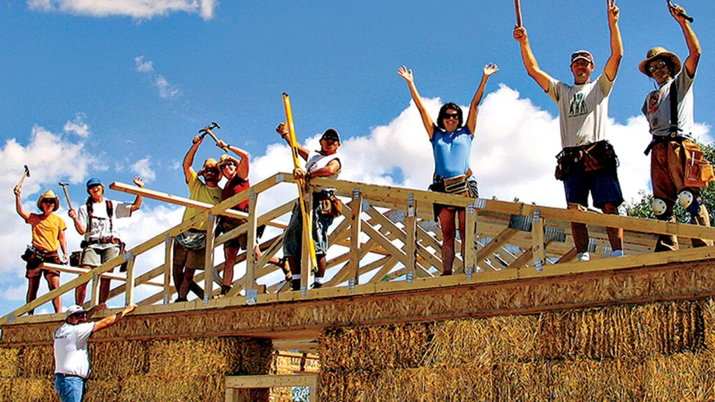 Guideposts volunteers work on a construction project for Red Feather Development Group