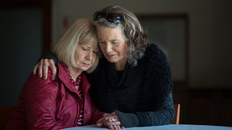 Woman consoling friend