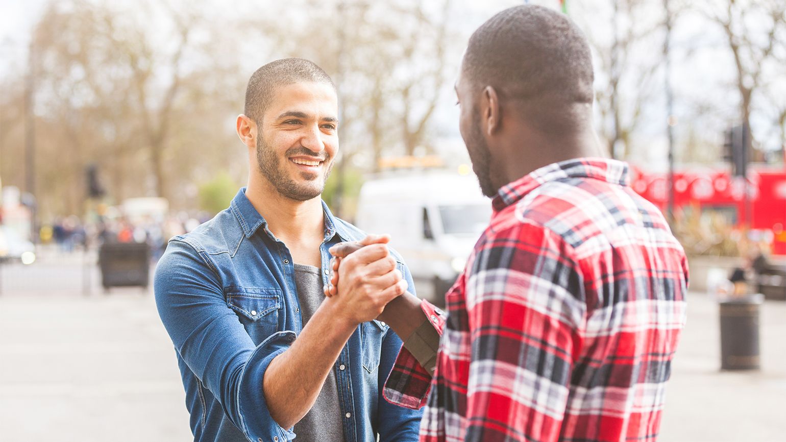 Young men shaking hands