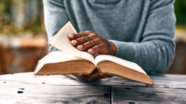 A man reads an open Bible