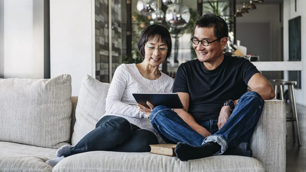 Couple watching videos on their tablet