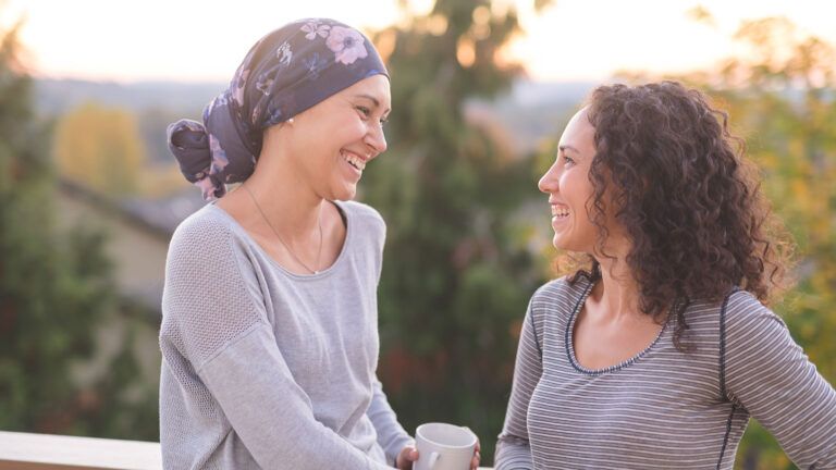 Two women talking outdoors