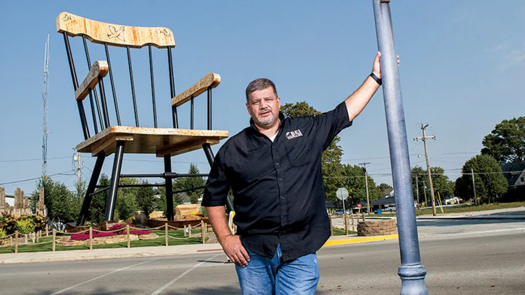 Jim Bolin in front of the World's Largest Rocking Chair; photo by Michael D. Tedesco