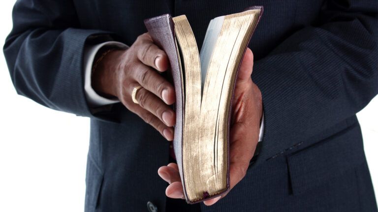 Pastor holding a bible