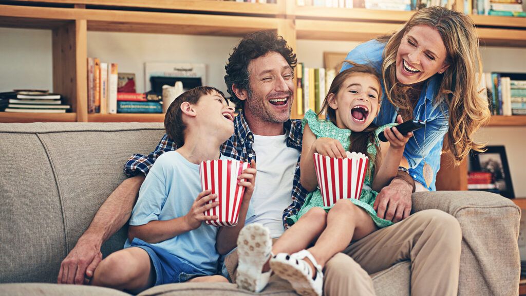 Family enjoying a movie together