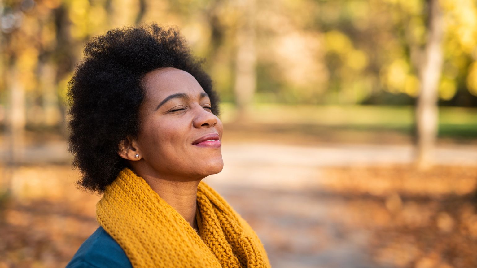 A woman enjoying the Autumn weather; Getty Images