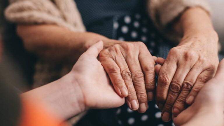 Hands holding each other