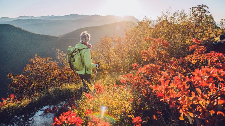 Woman hiking, enjoying the fall weather