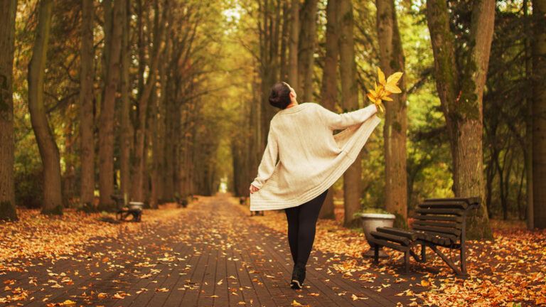 Woman enjoying autumn weather at the park