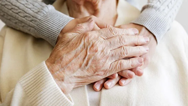 Hands together; Getty Images/iStock Photo