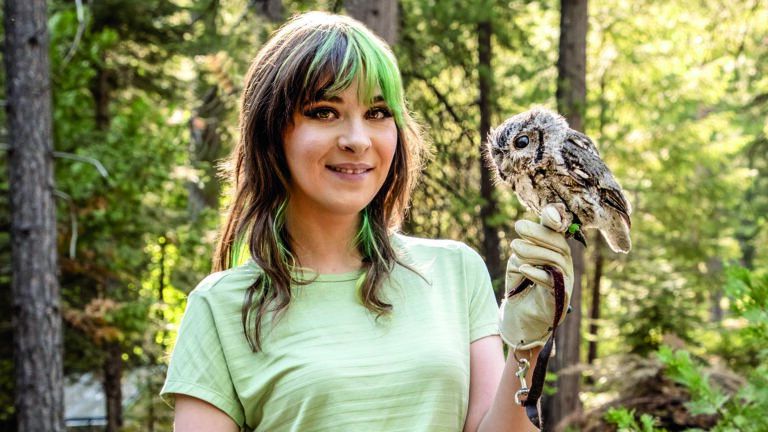 Teddy posing with Marbles, a Western Screech owl