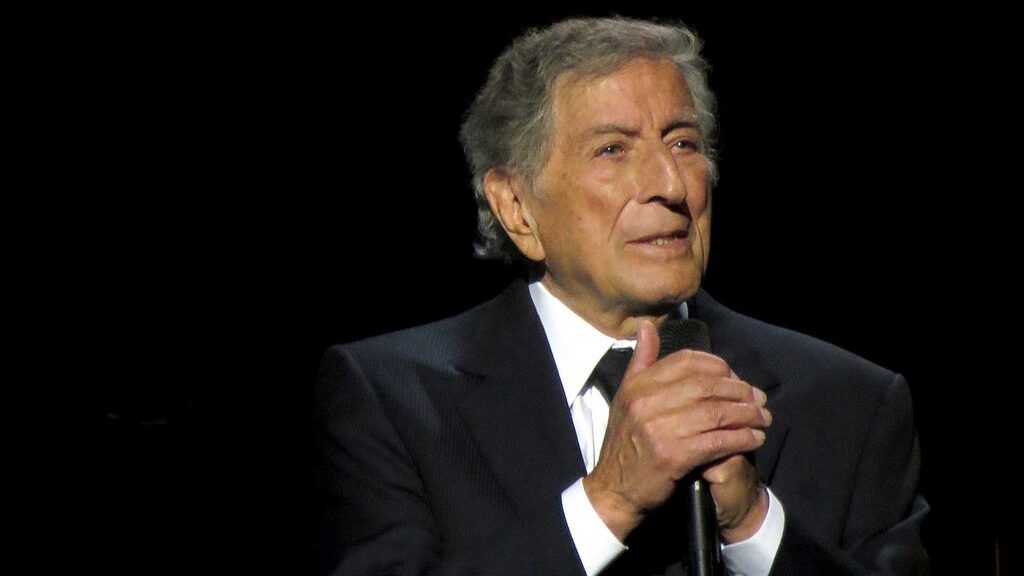 Tony Bennett holding a microphone