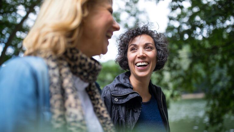 Two female friends smiling