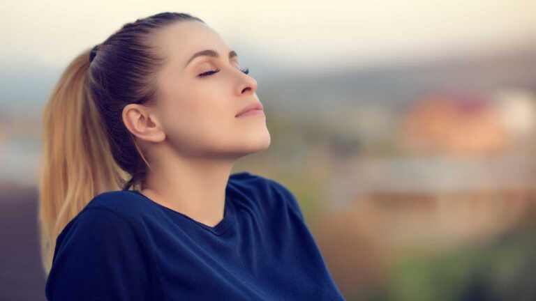 Woman taking a deep breath