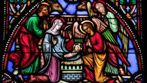 A stained glass window depicting the Nativity