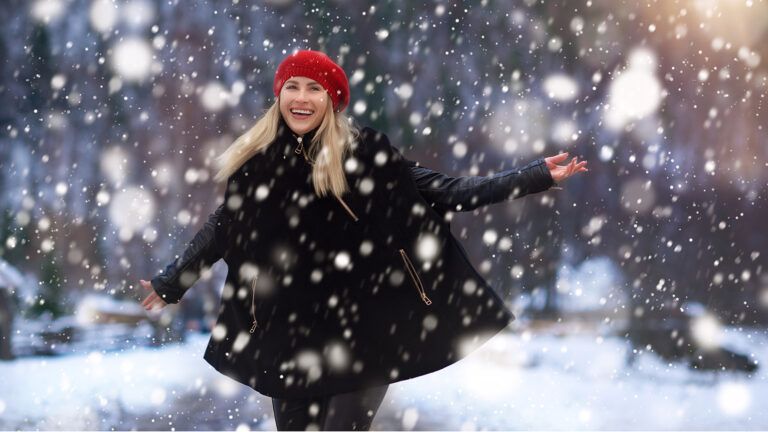 A woman strolls on a snowy day