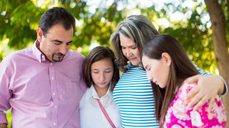 Family praying together