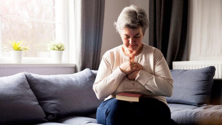 Senior woman praying