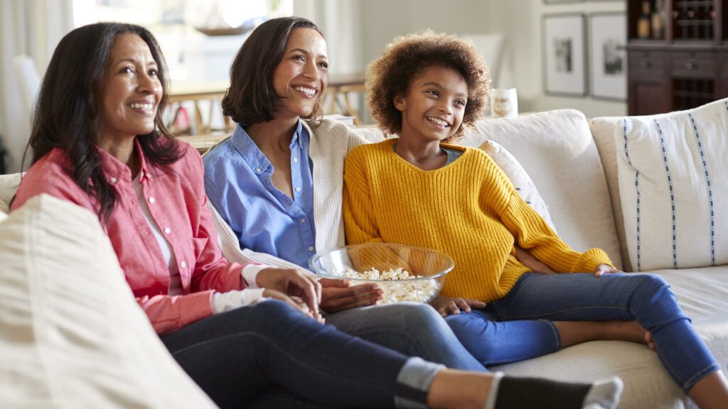 Mothers and daughters watching TV