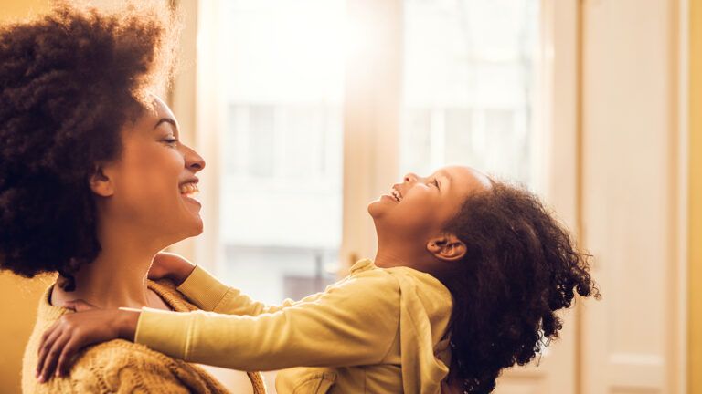 Mother holding her daughter