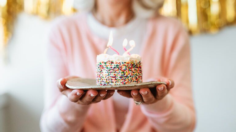 Woman holding a birthday cake