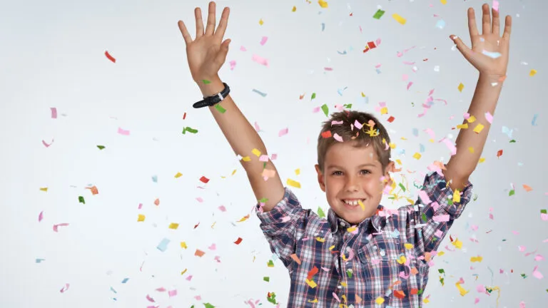 Boy celebrating accomplishments