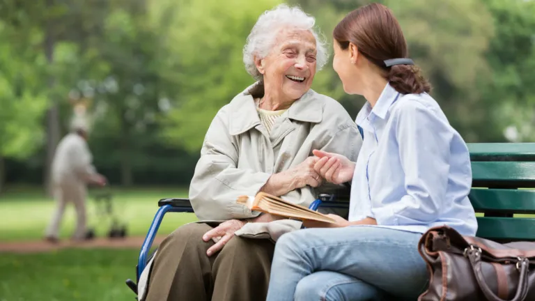 Caregiver and aging patient; Getty Images