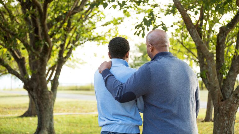 A man encourages his friend