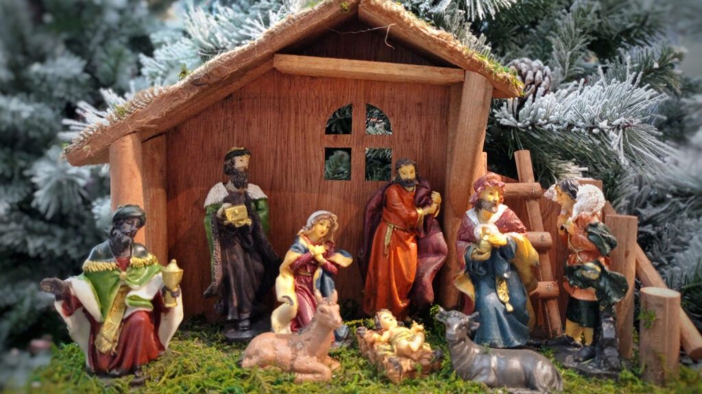 A nativity scene set up with a nativity prayer