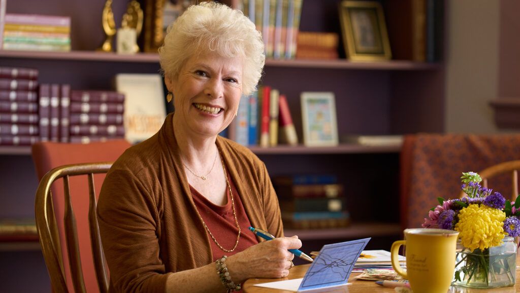 Jeanette Levellie composes a handwritten note of thanks; photo by Matthew Gilson