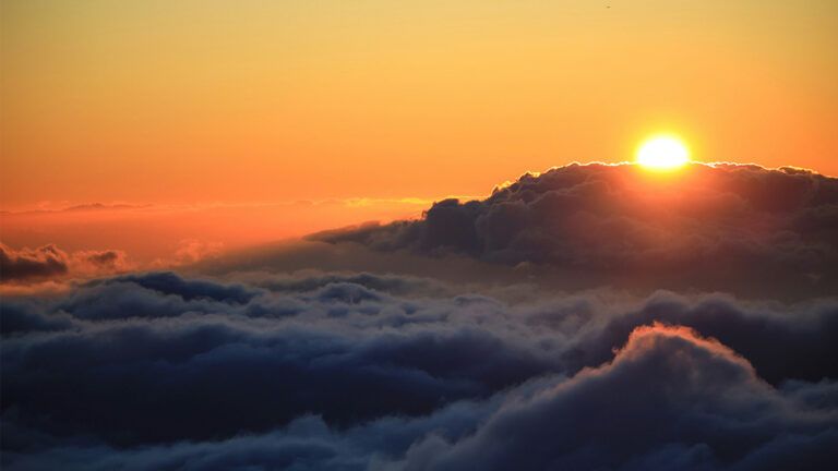 A vibrant sunset above the clouds.