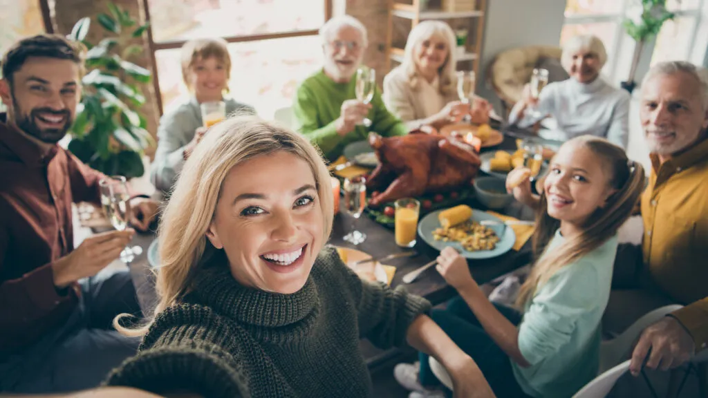 Family gathering together for a feast.