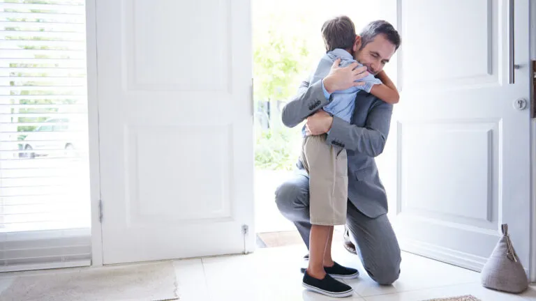 Father hugging his young son