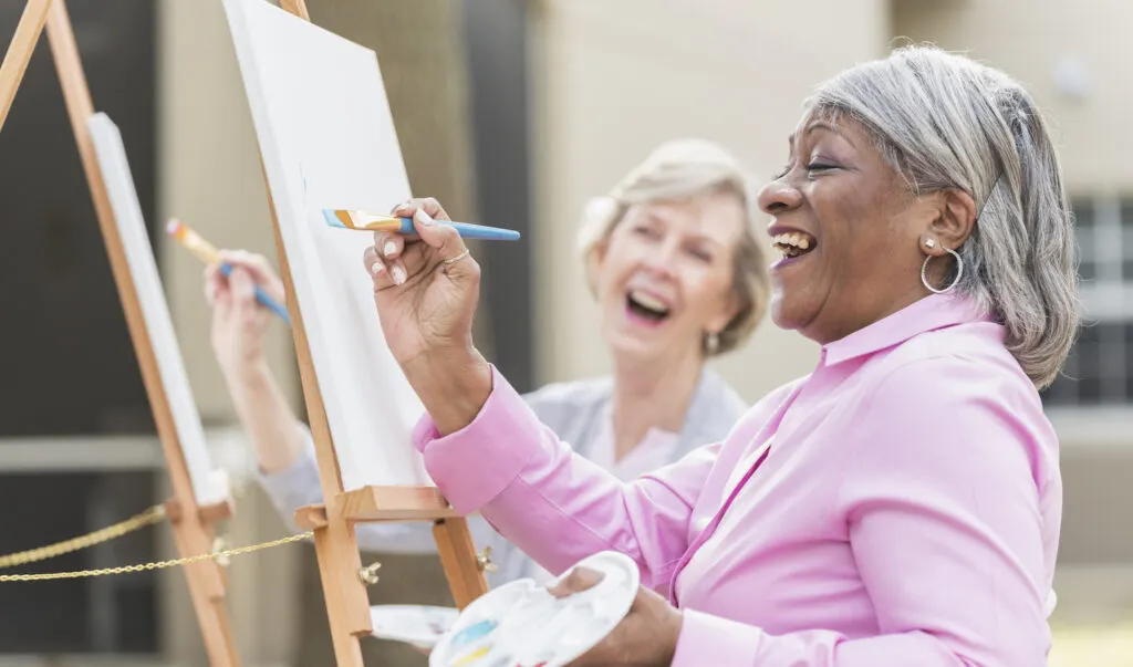 Two women take a painting class