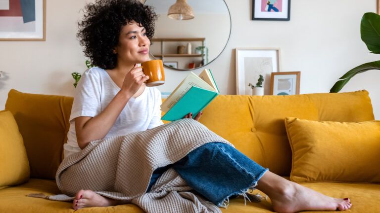 Woman reading a book about spiritual balance