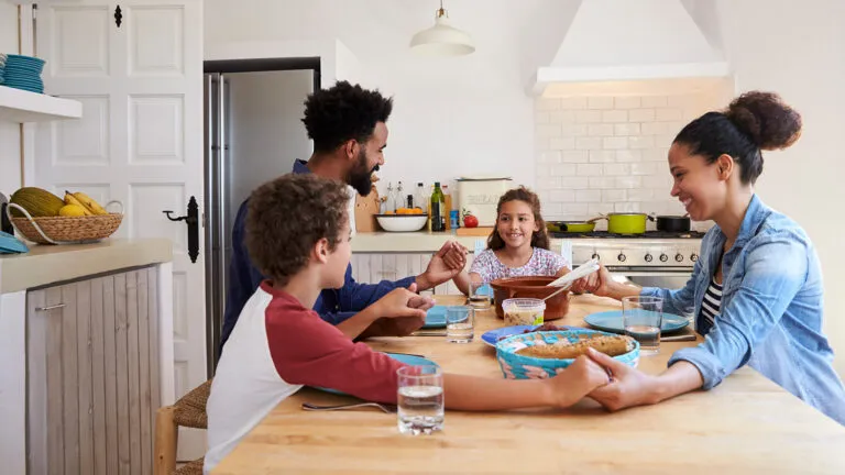 A mother and father at the dinner table keeping their family on track this lent